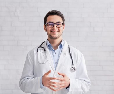 remote-work-young-doctor-in-white-coat-on-brick-w-2021-08-28-09-00-30-utc-Custom-1.jpg